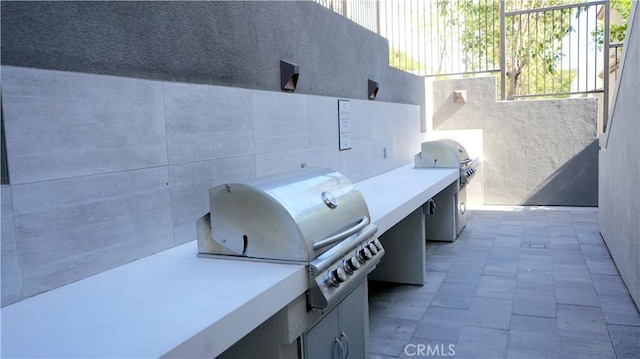 view of patio featuring an outdoor kitchen and area for grilling