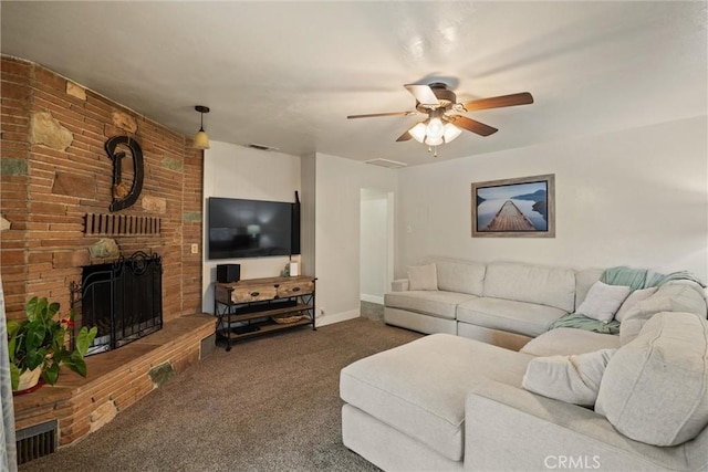carpeted living area featuring a ceiling fan, visible vents, baseboards, and a fireplace