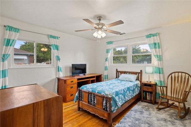 bedroom featuring ceiling fan and light wood-style flooring