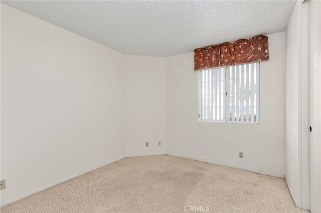 819 Miller Rd, Banning, CA 92220 - spare room with baseboards, a textured ceiling, and carpet