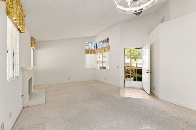 819 Miller Rd, Banning, CA 92220 - interior space featuring a notable chandelier, a textured ceiling, visible vents, and carpet
