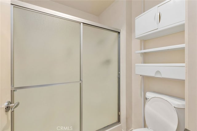 819 Miller Rd, Banning, CA 92220 - bathroom featuring a shower with shower door and toilet