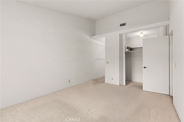 819 Miller Rd, Banning, CA 92220 - unfurnished bedroom featuring visible vents, a closet, and carpet flooring