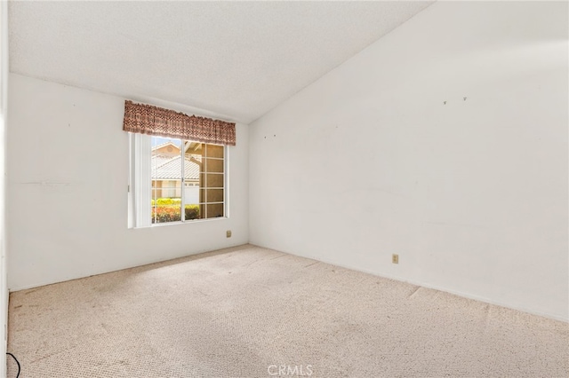 819 Miller Rd, Banning, CA 92220 - spare room with carpet flooring and vaulted ceiling