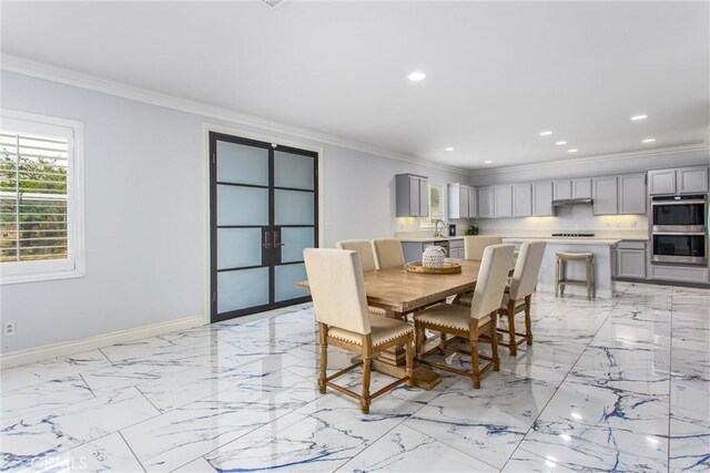 dining area with baseboards, recessed lighting, ornamental molding, and marble finish floor