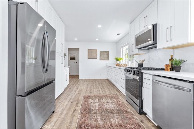 40 Frontier Way, Templeton, CA 93465 - kitchen featuring white cabinets, appliances with stainless steel finishes, light countertops, light wood-type flooring, and recessed lighting