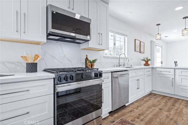40 Frontier Way, Templeton, CA 93465 - kitchen featuring white cabinetry, light wood-style floors, appliances with stainless steel finishes, and a sink