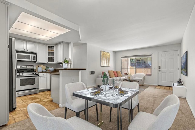 dining room featuring baseboards