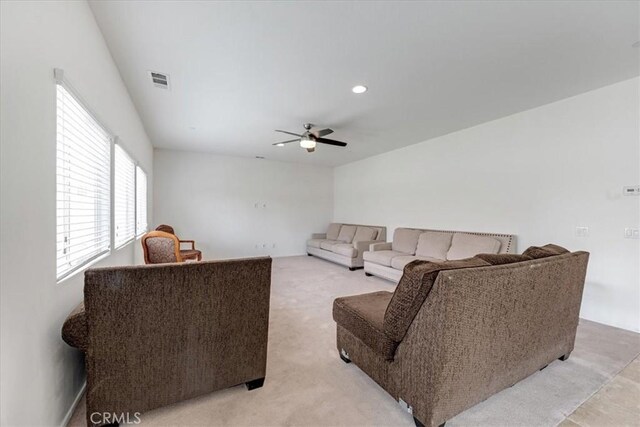 living room featuring recessed lighting, visible vents, ceiling fan, and light colored carpet