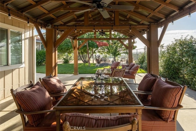 view of patio featuring outdoor lounge area, a ceiling fan, a gazebo, and fence