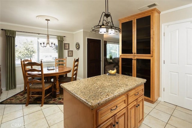 kitchen with light stone counters, pendant lighting, a chandelier, visible vents, and light tile patterned flooring