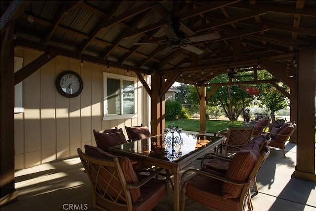 view of patio / terrace featuring outdoor dining area, a gazebo, and ceiling fan