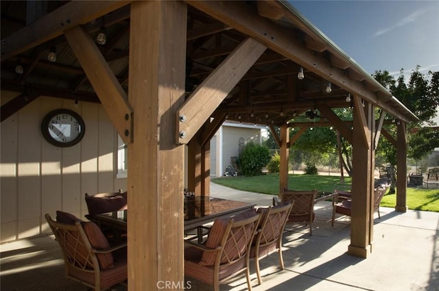 view of patio / terrace with outdoor dining space and a gazebo
