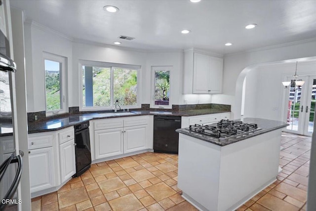 kitchen with black dishwasher, gas cooktop, a healthy amount of sunlight, and visible vents