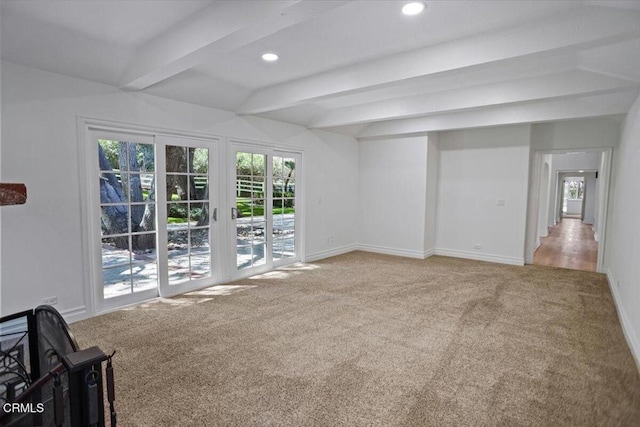 unfurnished living room featuring baseboards, recessed lighting, beamed ceiling, and carpet