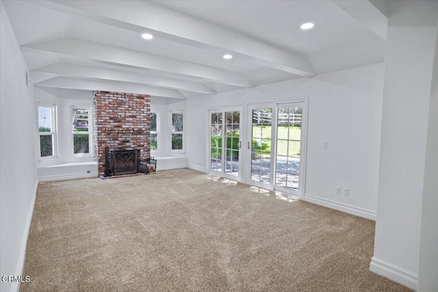 unfurnished living room featuring carpet flooring, beam ceiling, and baseboards