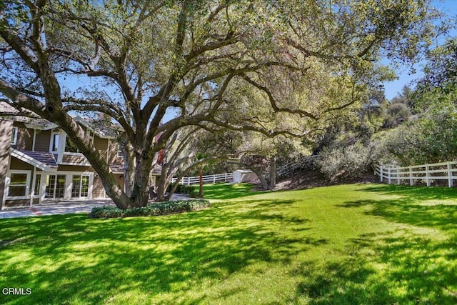 view of yard with a patio and fence