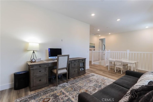 office featuring baseboards, recessed lighting, and wood finished floors