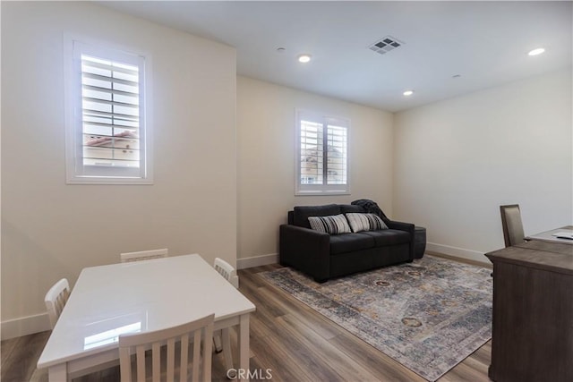 office area with baseboards, visible vents, wood finished floors, and recessed lighting