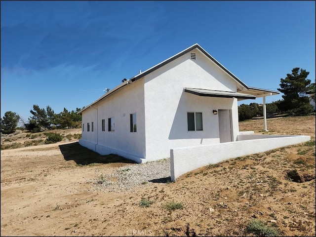 8581 Montara Rd, Pinon Hills, CA 92372 - view of property exterior with stucco siding