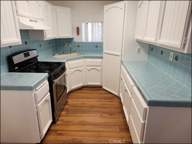 8581 Montara Rd, Pinon Hills, CA 92372 - kitchen with stainless steel range with gas stovetop, tile countertops, under cabinet range hood, and a sink