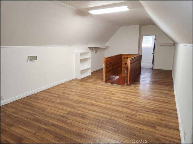 8581 Montara Rd, Pinon Hills, CA 92372 - bonus room with lofted ceiling, visible vents, baseboards, and wood-type flooring
