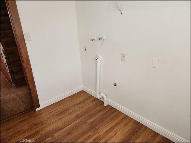 8581 Montara Rd, Pinon Hills, CA 92372 - laundry area with wood finished floors, washer hookup, laundry area, and baseboards
