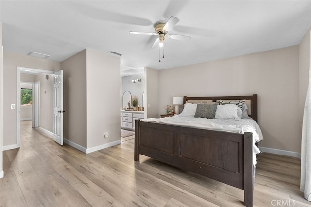 bedroom featuring baseboards, visible vents, and light wood-type flooring