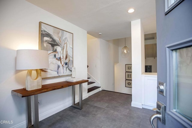 foyer entrance featuring recessed lighting, stairway, and baseboards