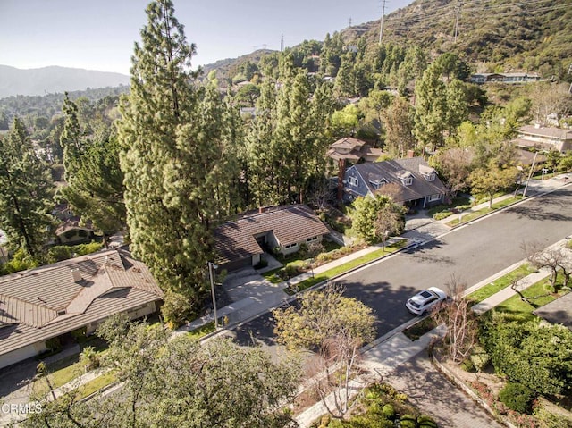 aerial view with a mountain view and a wooded view