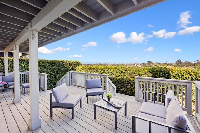 wooden deck with an outdoor living space