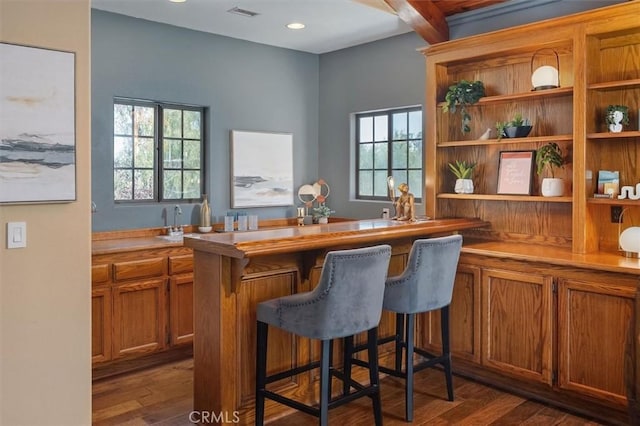 bar featuring visible vents, recessed lighting, beamed ceiling, and dark wood-style floors