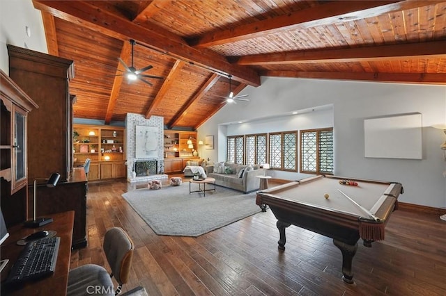 rec room featuring a large fireplace, ceiling fan, vaulted ceiling with beams, wood ceiling, and hardwood / wood-style flooring