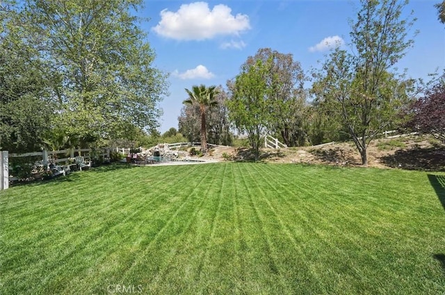 view of yard featuring fence