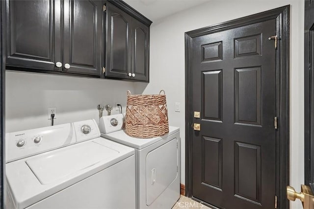 laundry room with cabinet space and washing machine and clothes dryer