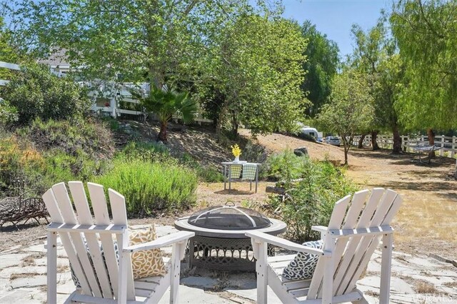 view of patio with an outdoor fire pit