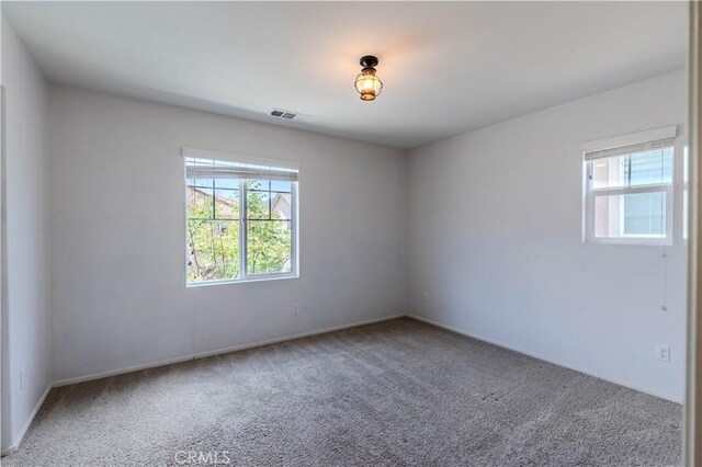 217 Oberlander Way, Fallbrook, CA 92028 - spare room featuring plenty of natural light, carpet flooring, and baseboards