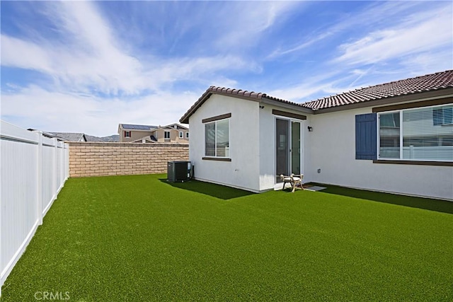 36225 Beacon Light Way, Wildomar, CA 92595 - back of house with central AC, a tile roof, a yard, stucco siding, and a fenced backyard