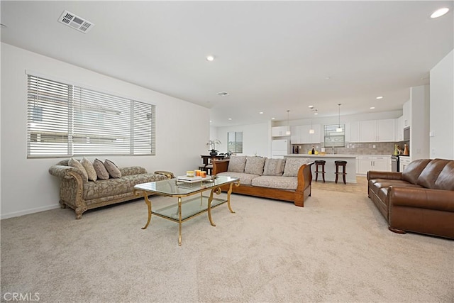 36225 Beacon Light Way, Wildomar, CA 92595 - living area featuring baseboards, recessed lighting, light carpet, and visible vents