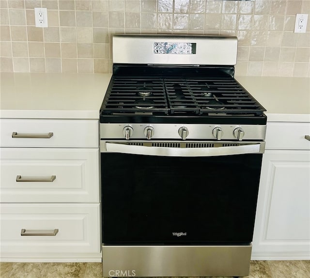 36225 Beacon Light Way, Wildomar, CA 92595 - room details featuring stainless steel range with gas cooktop, light countertops, white cabinetry, and decorative backsplash