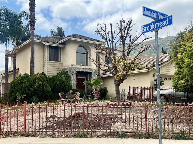 22527 Mountain View Rd, Moreno Valley, CA 92557 - view of front facade with stucco siding and fence private yard