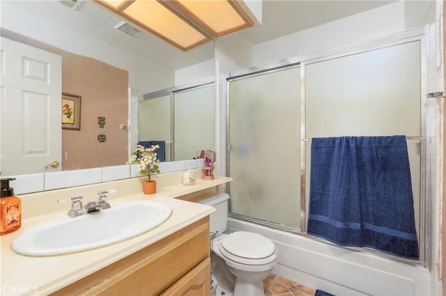 22527 Mountain View Rd, Moreno Valley, CA 92557 - bathroom with tile patterned flooring, vanity, toilet, enclosed tub / shower combo, and visible vents
