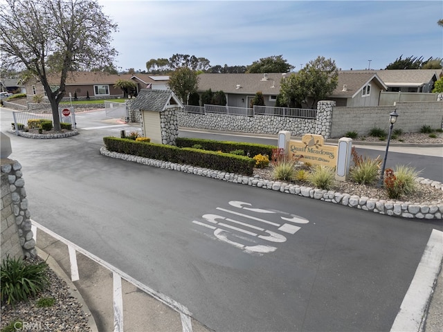 view of road featuring a residential view and street lights