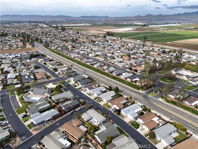 birds eye view of property featuring a mountain view and a residential view