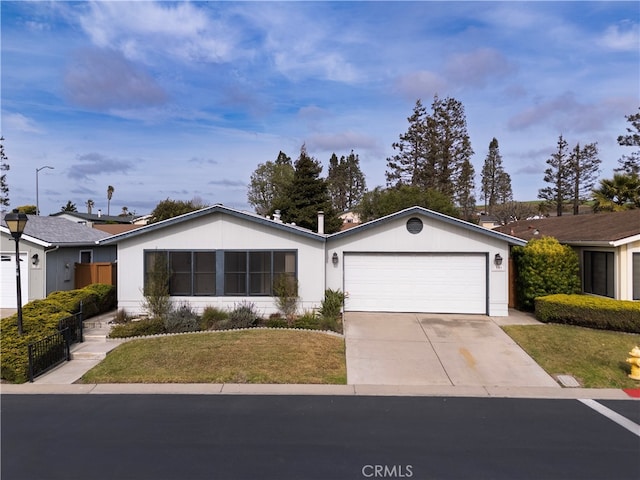 ranch-style home with driveway, a front lawn, and an attached garage
