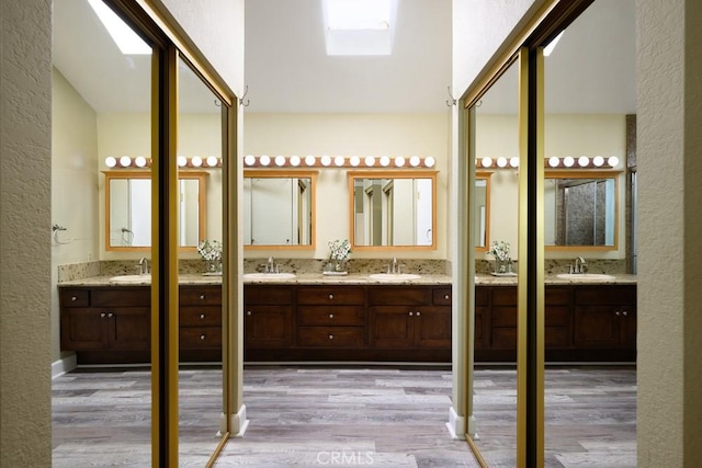 17355 Ridgedale Ln, Yorba Linda, CA 92886 - full bathroom with two vanities, a sink, and wood finished floors