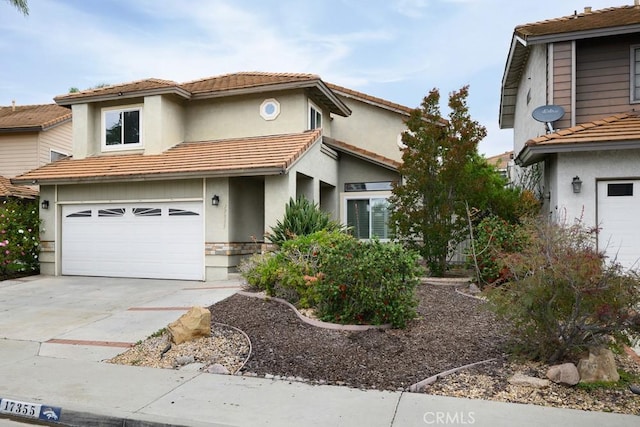 17355 Ridgedale Ln, Yorba Linda, CA 92886 - view of front of property featuring driveway, a tiled roof, stucco siding, and an attached garage