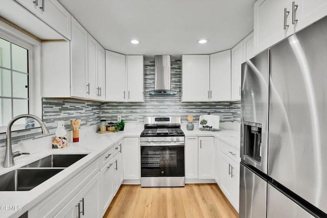 17632 E Covina Blvd, Covina, CA 91722 - kitchen featuring stainless steel appliances, wall chimney exhaust hood, white cabinetry, decorative backsplash, and recessed lighting