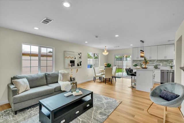17632 E Covina Blvd, Covina, CA 91722 - living area featuring light wood-style flooring and recessed lighting