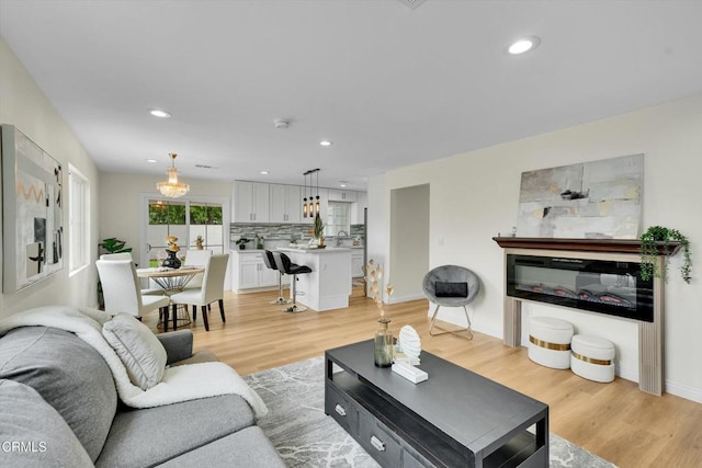 17632 E Covina Blvd, Covina, CA 91722 - living room with light wood finished floors and recessed lighting
